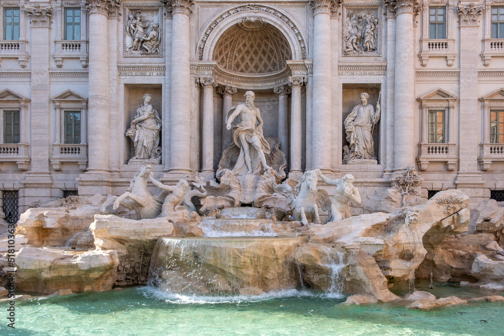 Close-up of one of the most famous fountain in the world in bright sunlight.  Rome.