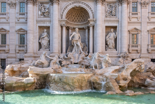 Close-up of one of the most famous fountain in the world in bright sunlight. Rome.