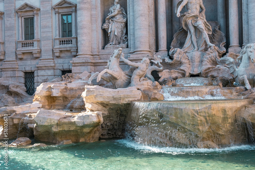 Close-up of one of the most famous fountain in the world in bright sunlight. Rome.