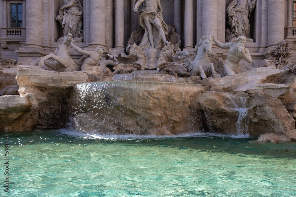 Close-up of one of the most famous fountain in the world in bright sunlight.  Rome.