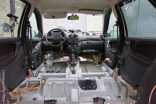 disassembled interior of the car without a seat and mats, repair the car.