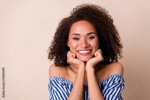 Portrait of cheerful adorable person toothy smile arms touch cheekbones isolated on beige color background