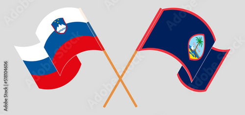 Crossed flags of Slovenia and Guam. Official colors. Correct proportion