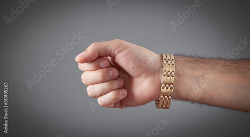 Photo Male hand with a expensive bracelet