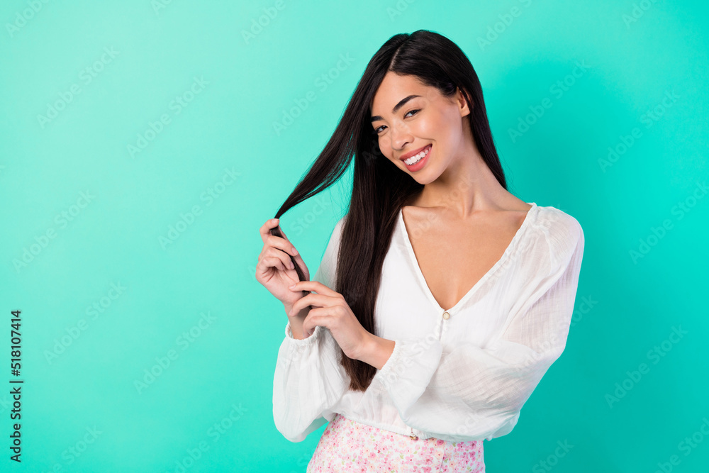 Photo of pretty cute lady enjoy anti dander therapy touch hair curls isolated cyan aquamarine color background Photo of pretty cute lady enjoy anti dander therapy touch hair curls isolated cyan aquamarine color background