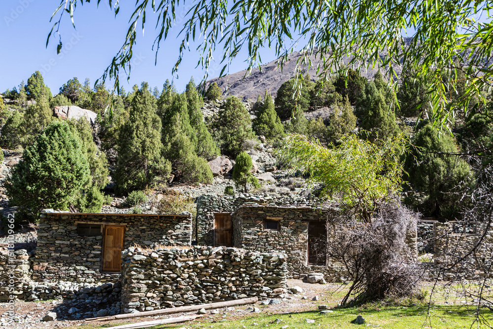 Stone buildings in Karakorum mountains on the way to Rakaposhi base camp. Minapin village, Karakoram, Pakistan Stone buildings in Karakorum mountains on the way to Rakaposhi base camp. Minapin village, Karakoram, Pakistan