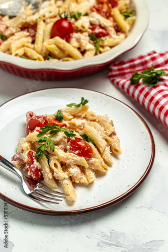 Trend Feta pasta recipe made of cherry tomatoes, feta cheese, garlic and herbs. cooking recipe ingredients, vertical image. top view. place for text