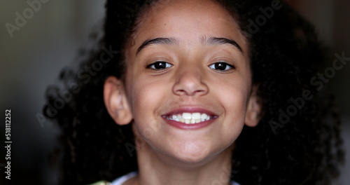 Mixed race little girl child smiling at camera portrait face
