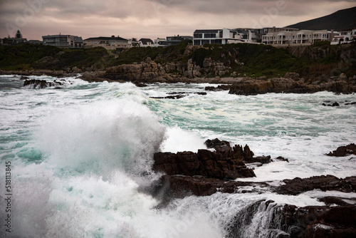 Water breaking on the Hermanus cliff of the garden route along the fynbos peninsula that runs along the entire South African coast from Port Elizabeth to Cape Town, known as the whale city.
