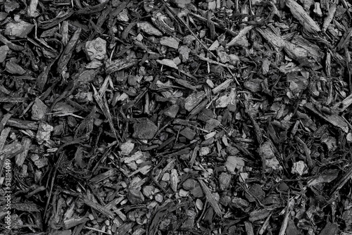 wooden dark black mulch or bark texture background  photo