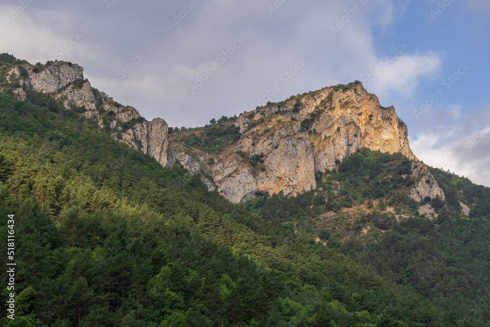 Scenic summer morning landscape panorama of rocky mountain ridge and forest in the Boulzane river valley near Gincla, Aude, France