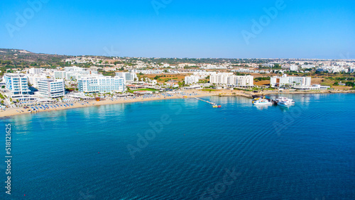 Aerial bird's eye view of Vathia Gonia beach, Ayia Napa, Famagusta, Cyprus. Landmark tourist attraction rocky bay with golden sand, sunbeds, sea restaurants in Agia Napa on summer holidays from above © f8grapher