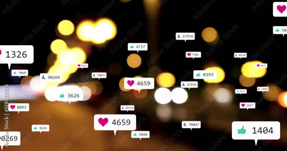 Animation of social media icons and numbers over out of focus city lights Animation of social media icons and numbers over out of focus city lights