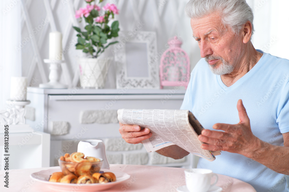 Senior man reading newspaper Senior man reading newspaper