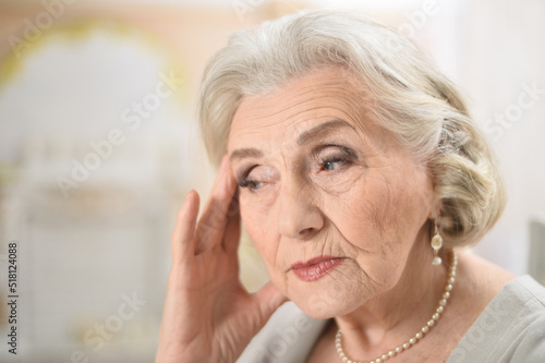 Portrait of a cute sad elderly woman