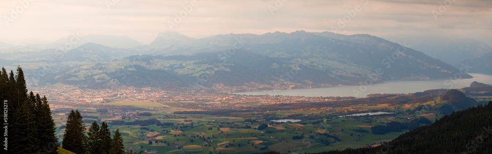 panoramic view over Thun and Lake Thun seen from Gantrisch during a summer sunset panoramic view over Thun and Lake Thun seen from Gantrisch during a summer sunset