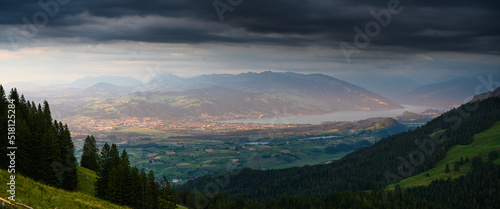 panoramic view over Thun and Lake Thun seen from Gantrisch during a summer sunset © schame87