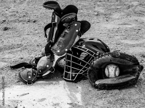 catcher equipment on the field black and white