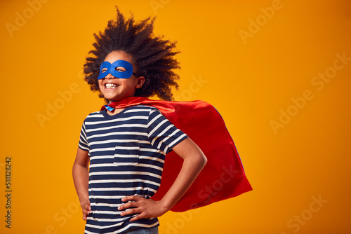 Foto Studio Portrait Of Boy Dressed As Comic Book Superhero Against Yellow Background