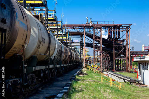 Cargo oil transportation in tanks by rail. Oil refinery area
