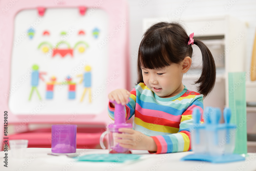 young girl pretend playing food preparing at home young girl pretend playing food preparing at home