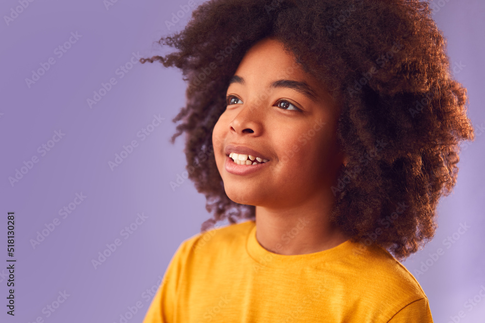 Studio Portrait Of Smiling Young Boy Shot Against Purple Background Studio Portrait Of Smiling Young Boy Shot Against Purple Background