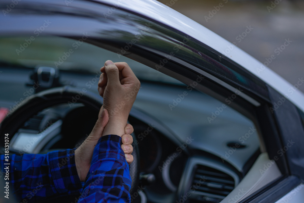 The young man had pain in his wrist while driving a long-distance car.