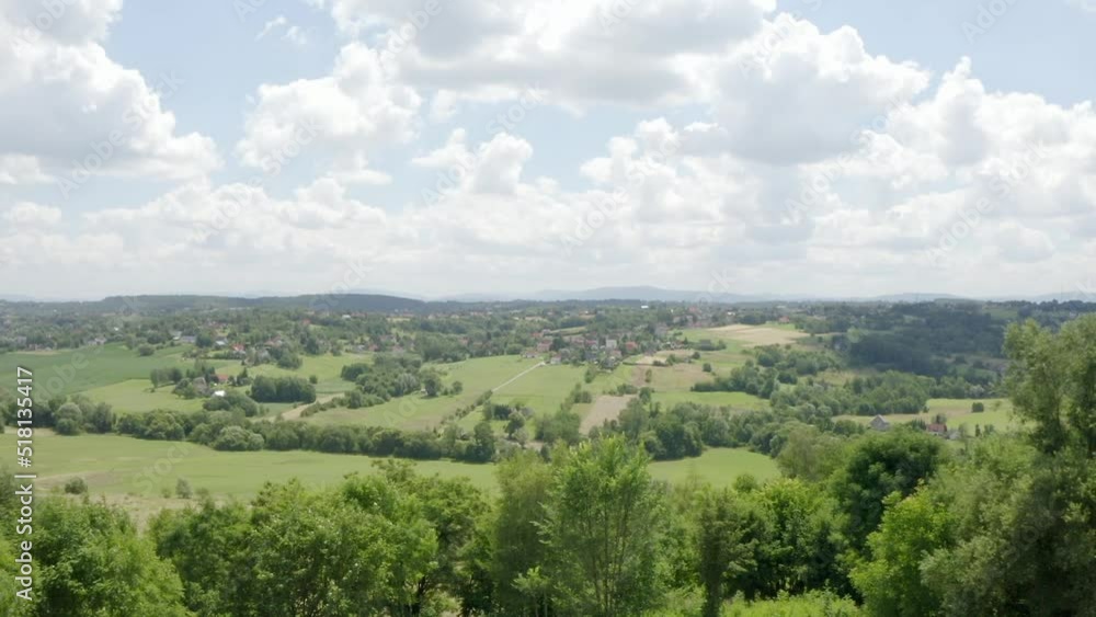 A modern European village in the foothills located on the slopes of the hills. Drone flight over fields, forests, meadows and agricultural pastures. Anthropogenic landscape studies. A modern European village in the foothills located on the slopes of the hills. Drone flight over fields, forests, meadows and agricultural pastures. Anthropogenic landscape studies.