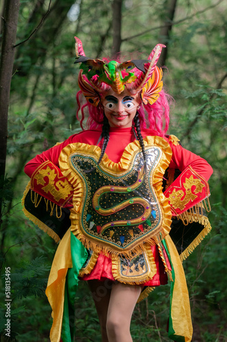 Ecuadorian Latina woman with devil mask, getting ready for the Diablada Pillareña parade.