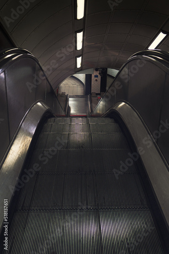 Canvas Print Shot looking downwards at an escalator descending into the London underground