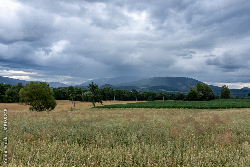 Dramatic stormy skies over farmland