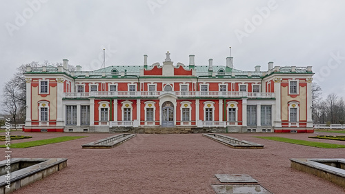 Presidential palace in baroque architecture style , guarded by two soldiers in traditional dress in Kadriorg, Tallinn, Estonia 