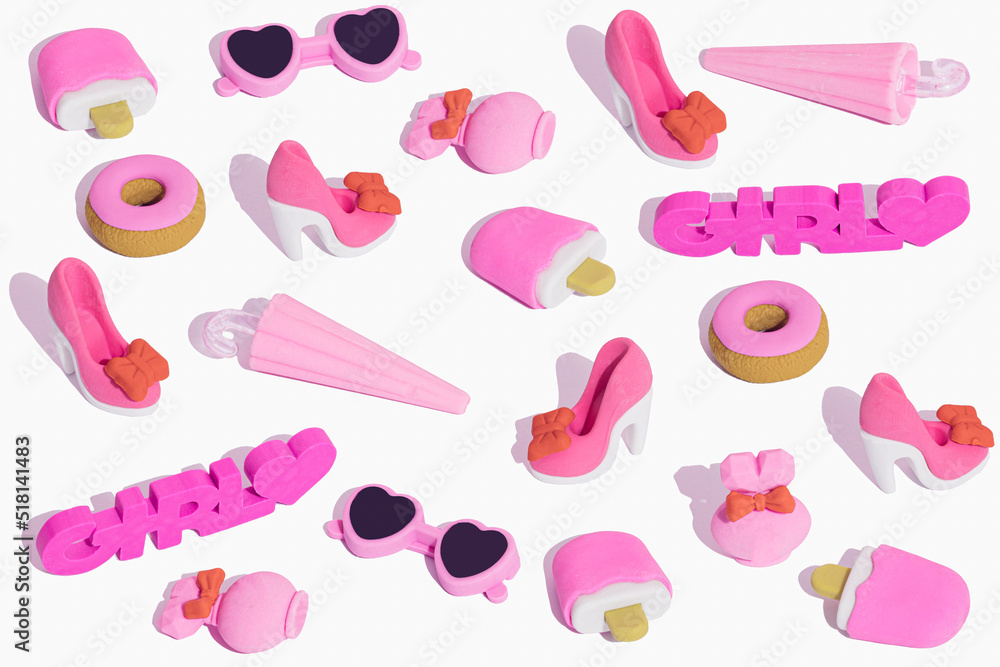 Creative pattern made of pink girls' stuff. Funny big set of girly things.  Make up, bag, purse, perfume, heart, heels, sweet donats, sunglasses. Cute  Cartoon Design. Stock Photo