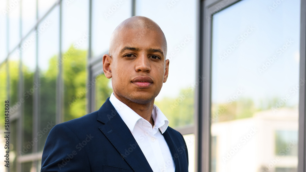 African american manager in suit looking at camera outdoors African american manager in suit looking at camera outdoors