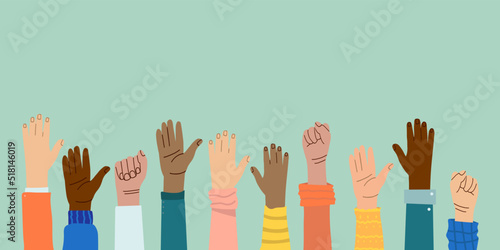 Hands and fists of people of different nationalities and races raised in the air. Protest and strike. Fighting for their rights. Men and women express dissatisfaction and defend their position