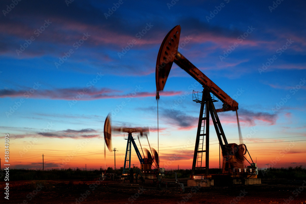 The oil pump is working under the clouds The oil pump is working under the clouds