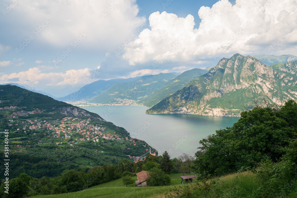 Panorama at Lake Iseo and Mount Corna Trentapassi at sunny day with clouds. Bergamo, Lombardy, Italy.