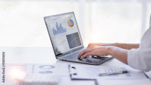 Businessman working at office with documents on his desk, doing planning analyzing the financial report, business plan investment, finance analysis concep