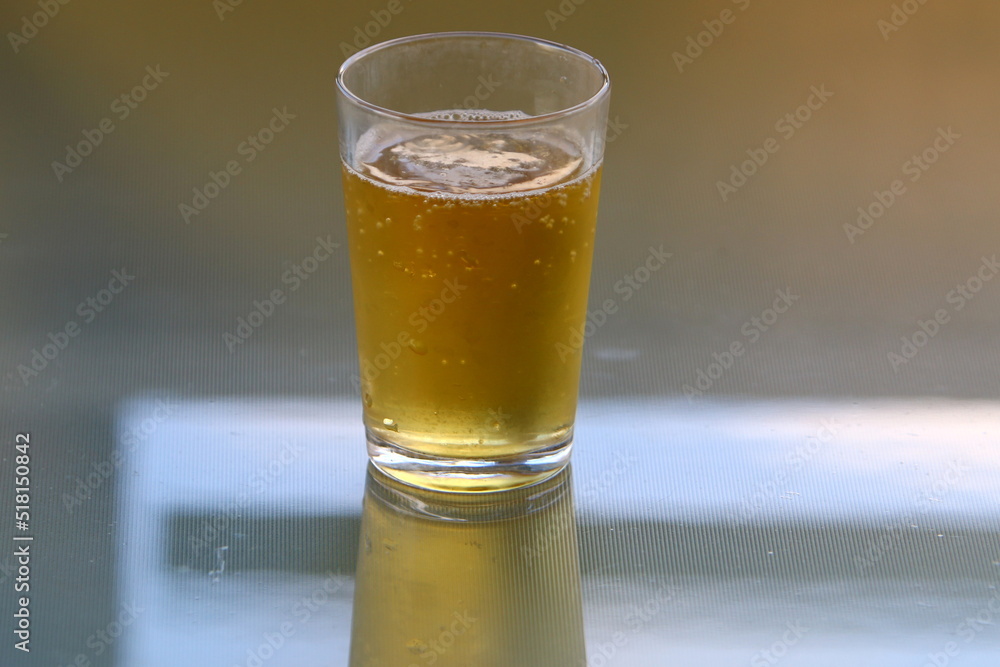On the table in a mug fresh , light beer . On the table in a mug fresh , light beer .