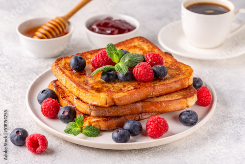 French toast with blueberries, raspberries, maple syrup