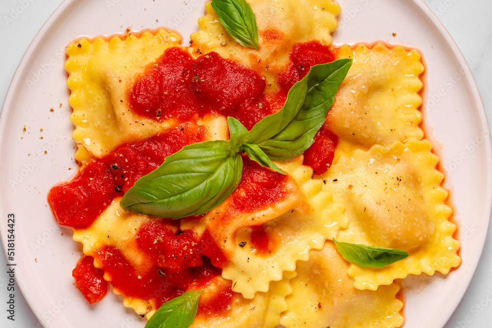 Delicious appetizing ravioli with tomato sauce and basil Delicious appetizing ravioli with tomato sauce and basil