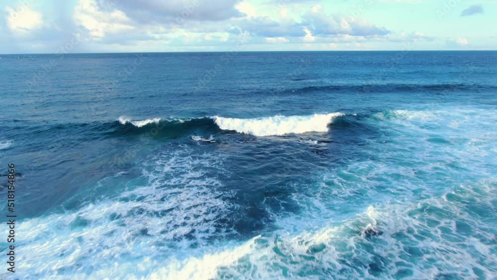 aerial pullout of wave crashing on rocky shore aerial pullout of wave crashing on rocky shore