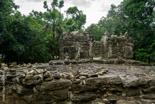 The ruins of an ancient Mayan altar against the backdrop of a gloomy forest in a thunderstorm. Mayan stone buildings, Yucatan, Mexico