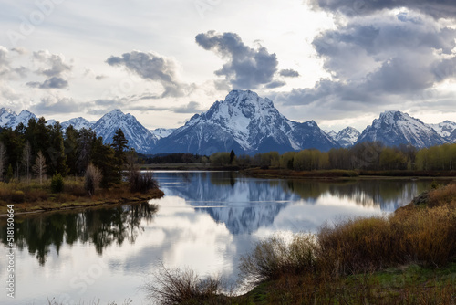 River surrounded by Trees and Mountains in American Landscape. Snake River, Oxbow Bend. Spring Season. Grand Teton National Park. Wyoming, United States. Nature Background.