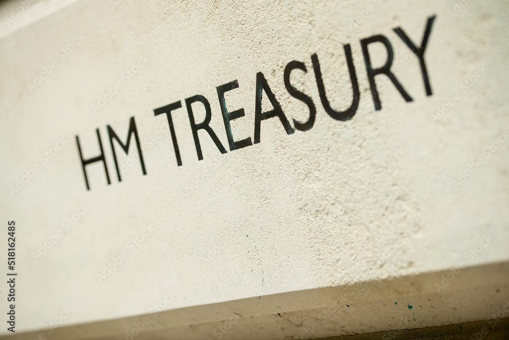 Angled view of HM TREASURY sign on Whitehall building in London, UK. Angled view of HM TREASURY sign on Whitehall building in London, UK.