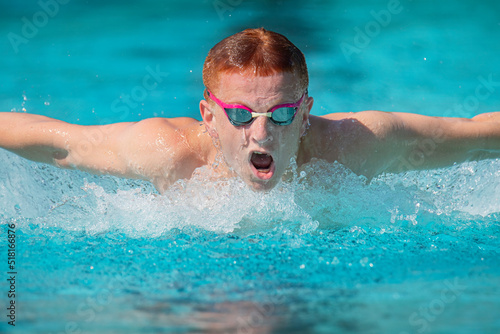 Close up young male swimmer doing butterfly © Michael O'Neill