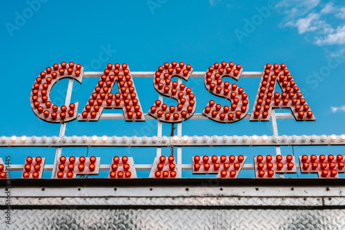 Cassa text made of red bulbs outdoor photo