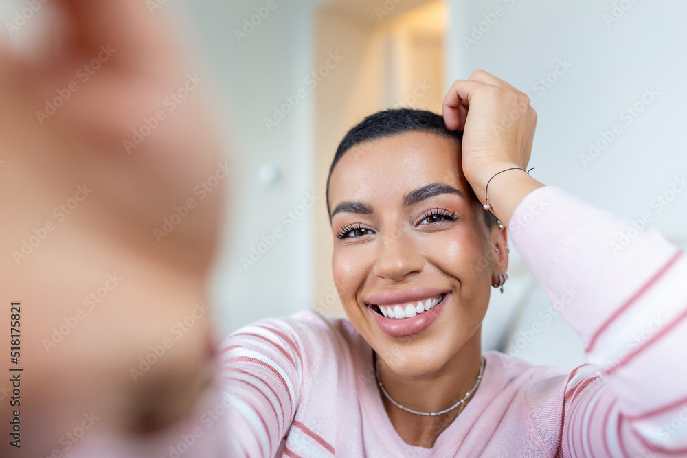 Portrait of a beautiful woman smiling at home. African American woman in casual looking at camera with copy space. Cheerful mixed race girl relaxing at home with big laugh. Portrait of a beautiful woman smiling at home. African American woman in casual looking at camera with copy space. Cheerful mixed race girl relaxing at home with big laugh.