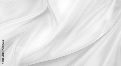 Close-up of rippled white silk fabric texture background 