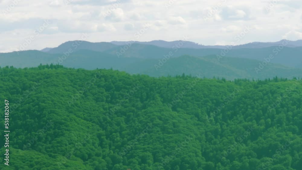 beautiful mountains landscape and dramatic cloudy sky.sunny summer day,trip,travel,family vacation concept.father with girl in arms is showing something with hand.amazing nature 4k real time